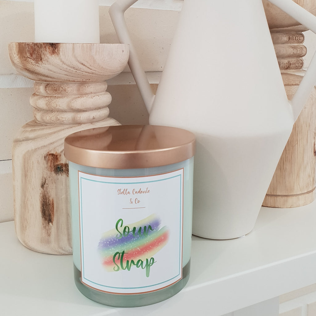 Our Sour Strap Candle has mouth watering flavours of creamy, sweet scents. Including peach, marshmallow, vanilla cream and apple. Unlock your favourite childhood memories with our colourful fruity candle.